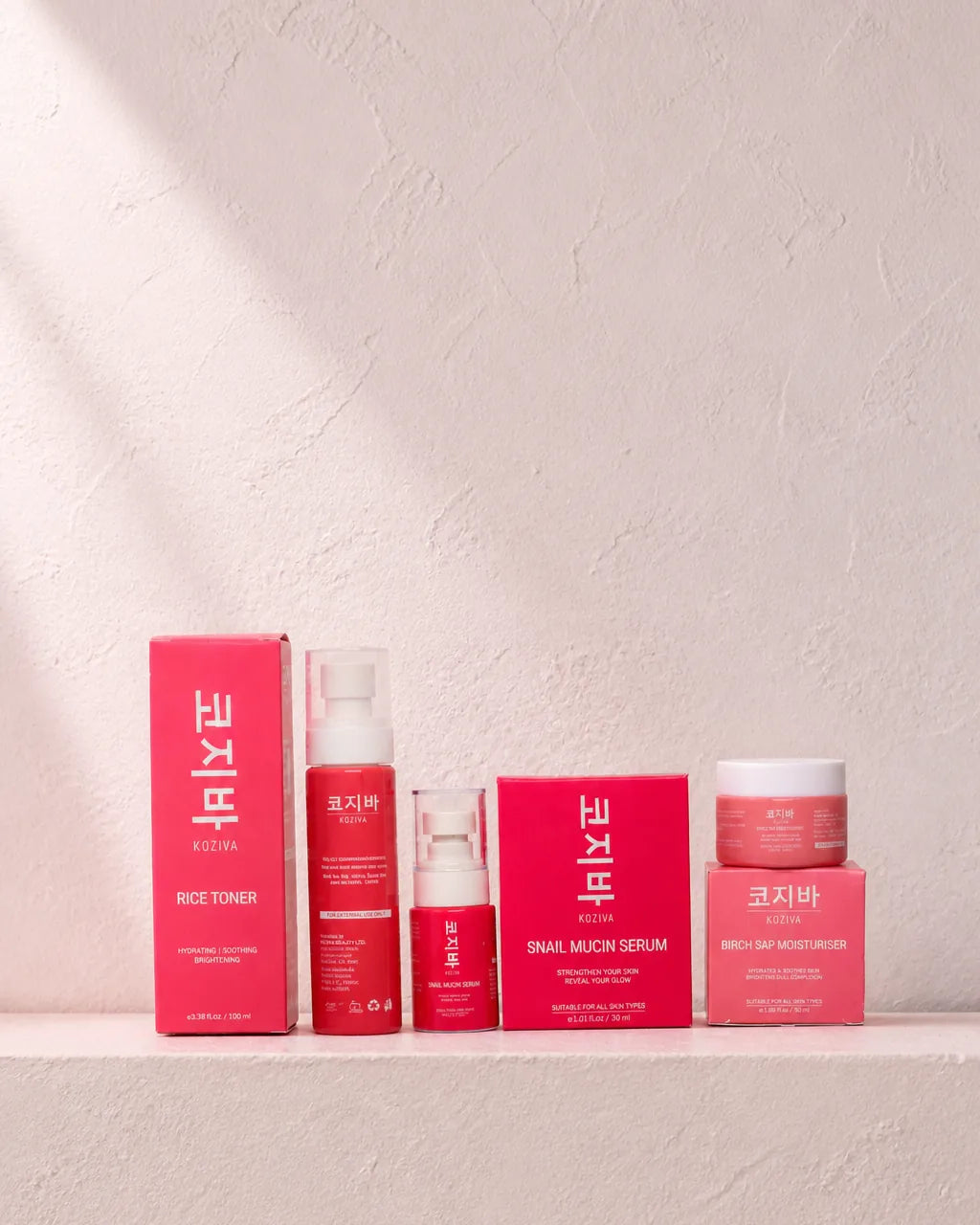 The three Koziva products with their cartons, arranged together as a set